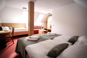 Hotel Pino Alpino客房内的一张或多张床位
