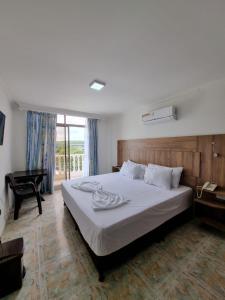 Zahira Hotel Melgar客房内的一张或多张床位