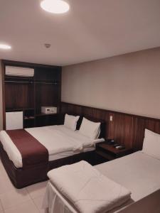 巴西利亚海滨大道活动酒店客房内的一张或多张床位