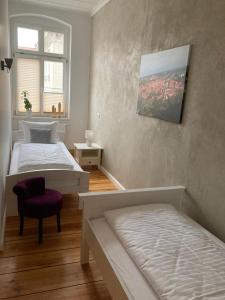 Bilderbuchcafe - Ferien - Apartment NO 3 - Markt 7客房内的一张或多张床位