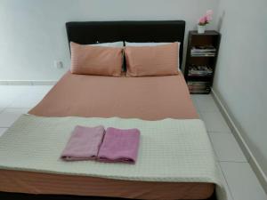 Raudhah homestay bertam客房内的一张或多张床位