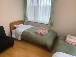 Akane-yado客房内的一张或多张床位