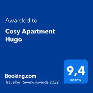 奥西耶克Cosy Apartment Hugo的蓝色的屏幕,文字被授予舒适的公寓