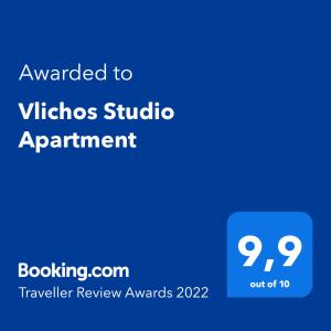 伊兹拉Vlichos Studio Apartment的蓝色标语,标有维克斯一室公寓