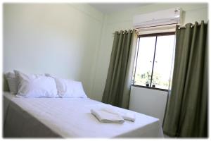 Bonito Residencial Flat客房内的一张或多张床位