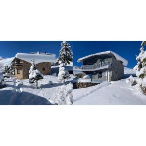 泰托沃Villa 80 Kodra e Diellit的雪中房子的两张照片