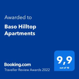 阿凯松Baso Hilltop Apartments的蓝屏,文字被授予巴索山顶公寓