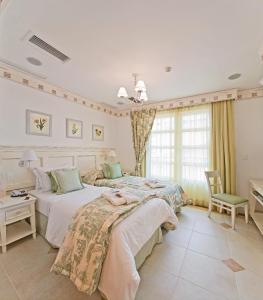 IL Campanario Villaggio Resort - OFICIAL客房内的一张或多张床位