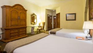 阿瓜斯卡连特斯金塔实酒店客房内的一张或多张床位