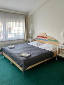 索波特游艇俱乐部旅馆客房内的一张或多张床位