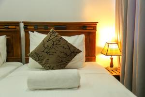 Kandy Tower Inn客房内的一张或多张床位