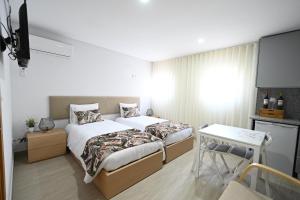 O Visconde - Alojamento local客房内的一张或多张床位