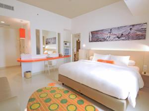 沙马林达哈里斯酒店客房内的一张或多张床位