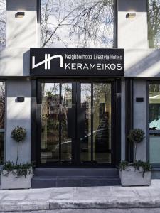 雅典NLH KERAMEIKOS - Neighborhood Lifestyle Hotels的建筑物前的标志