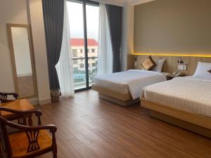Thanh Bình Hotel - 47 Y Bih - BMT客房内的一张或多张床位