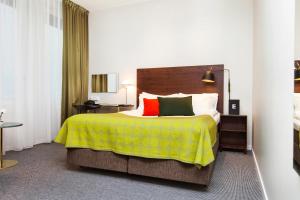 隆德伊德恩精英酒店客房内的一张或多张床位