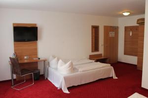 慕尼黑安德拉酒店客房内的一张或多张床位
