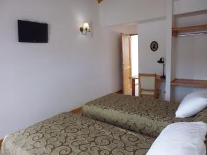 弥维达旅馆客房内的一张或多张床位
