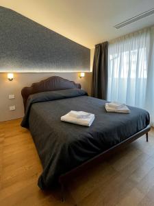 Villino Milano客房内的一张或多张床位
