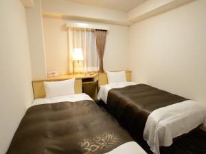 Nagoya Sakae Green Hotel客房内的一张或多张床位