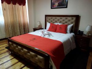 HOTEL VELANEZ SUITE Riobamba客房内的一张或多张床位