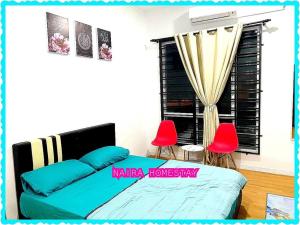 Naira Homestay Kota Bharu ,Wakaf Che Yeh 4 Bilik 3 Aircond客房内的一张或多张床位