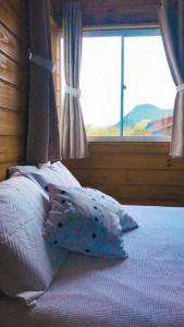 Bangalôs Floripa - Tiny House客房内的一张或多张床位