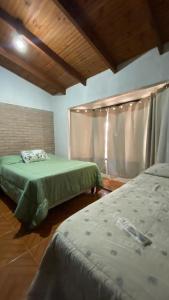 Escape a la Naturaleza客房内的一张或多张床位