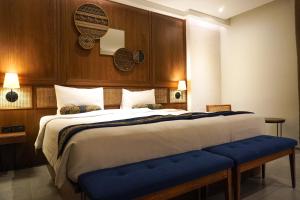 万隆爪哇酒店客房内的一张或多张床位