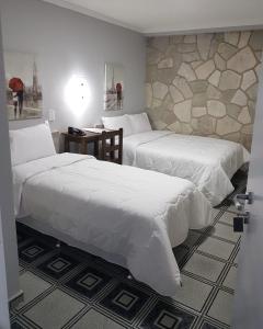 HOTEL CATARINA BAURU客房内的一张或多张床位