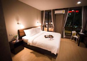 曼谷C U酒店 - SHA Plus客房内的一张或多张床位