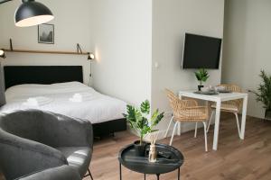 Four Star Apartments - Keizerstraat客房内的一张或多张床位