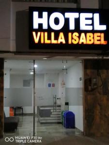 帕斯托Hotel Villa Isabel的机场的别墅异形标志