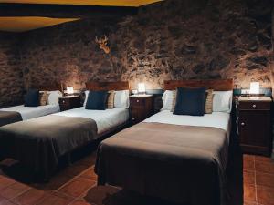 Hotel Rural Curia客房内的一张或多张床位