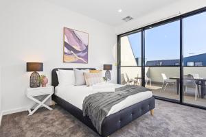 Hobart Lane Townhouses客房内的一张或多张床位