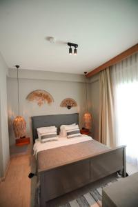 Alp Suites Mandalin客房内的一张或多张床位