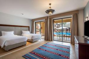 Marina Resort Port Ghalib, a member of Radisson Individuals客房内的一张或多张床位