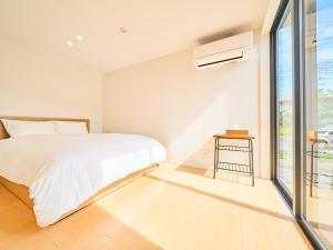 Rakuten STAY HOUSE x WILL STYLE Miyazaki Aoshima 101客房内的一张或多张床位