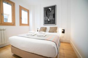 Smartr Madrid Gran Via Apartments客房内的一张或多张床位