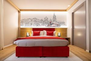 伯尔尼NEW OPENING 2022 - Los Lorentes Apartments Bern City的卧室配有红色的床,墙上挂着画