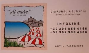 奇维塔韦基亚Guest house al mare的带有海滩图画的日历,带有遮阳伞