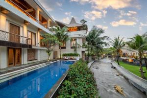 吉安雅Harsono Boutique Resort Bali的享有带游泳池的别墅外景