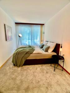 Ruhiges Terrassen-Apartment mit Blick ins Grüne客房内的一张或多张床位