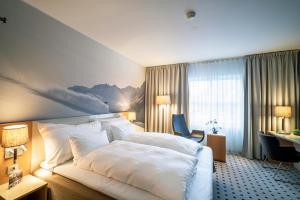 Grand Hotel - by Classic Norway Hotels客房内的一张或多张床位