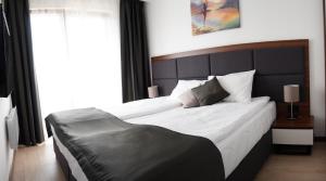 Apart & Spa Zoned客房内的一张或多张床位