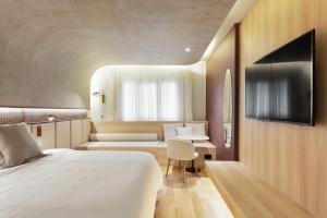 QOYA Hotel Curitiba, Curio Collection by Hilton客房内的一张或多张床位