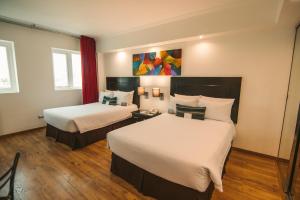 萨尔瓦多罗公寓酒店 客房内的一张或多张床位