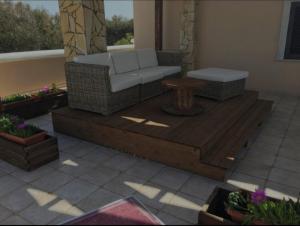 法维尼亚纳Villa Oblò的平台上设有带沙发和桌子的庭院