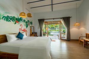 Khu Nghỉ Dưỡng Green Bungalow Phu Quoc客房内的一张或多张床位