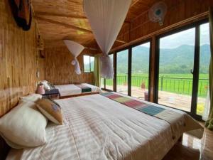 Little Mai Chau Home Stay客房内的一张或多张床位